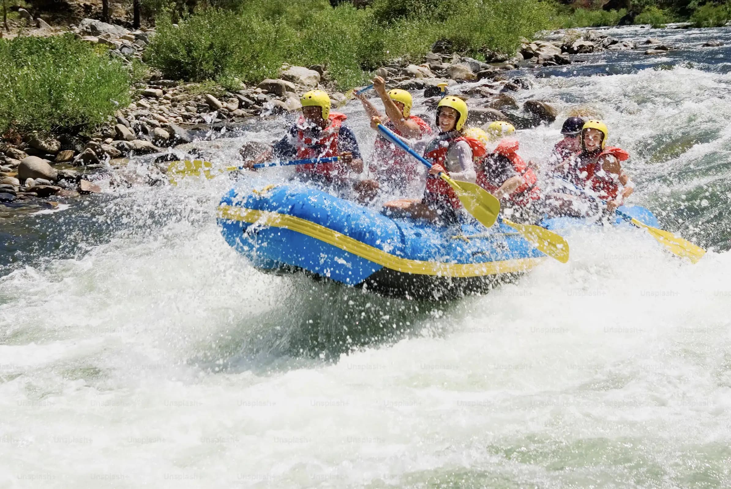 rapid report hero image with mountains and raft in the river